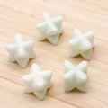 Light green Aventurine quartz Merkaba star stone ornaments on wood background - Xiu Jade