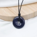 Blue goldstone donut pendant necklace with black cord and sparkling starry effect - Blue Goldstone (Synthetic)