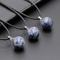 Three-piece set of sodalite sphere pendants with blue and white marble pattern on cords - Blue Spot Jasper
