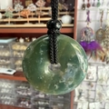Green crystal donut pendant with natural textures and adjustable black woven cord necklace - India Agate