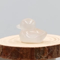 Polished natural pink white agate crystal carved duck on a rustic wooden base - Agate