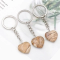 Brown heart-shaped natural stone keychain with silver metal ring and fluid sand texture - Jasper