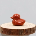 Hand-carved red jasper stone duckling figurine with a smooth polished finish - Red Jasper