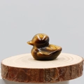 Handcrafted yellow tiger eye stone duck carving figurine on a wooden base - Tiger's Eye
