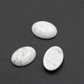 Set of three oval white turquoise stone cabochons with natural grey marbled patterns - Howlite