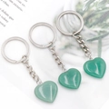 Three green aventurine crystal heart keychains with polished natural stone texture - Green Aventurine