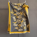 Detail of grey winter shawl with vibrant yellow floral patterns and white fringe trim - Yellow Grey