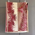 Close-up of vintage floral print scarf with warm cashmere texture and fine fringe edge - Brown Beige Red