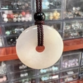 Natural light pink stone donut pendant necklace with dark brown woven cord accessory - Pink Aventurine