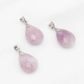 Faceted lavender amethyst teardrop pendant set with silver bails on white fabric - Phosphosiderite