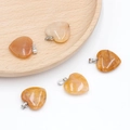 Five heart-shaped orange aventurine natural stone pendants with silver metal clasps - Topaz