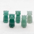 Five assorted green natural crystal dog carvings made from jade and agate stones - Green Aventurine