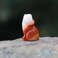 Hand-carved natural agate wolf figurine in unique dual-tone white and reddish-brown finish - Colored Jade