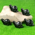 Set mit fünf polierten schwarzen Naturstein-Schneckenfiguren aus Obsidian - Obsidian