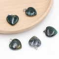 Moss agate heart pendant with silver bail featuring natural green stone texture - India Agate