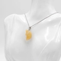 Face moon pendant carved from translucent yellow natural stone on silver chain - Topaz