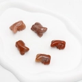 Set of five hand-carved red jasper frog figurines with natural polished mineral texture - Purple Aventurine