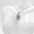 Purple natural crystal moon face pendant with carved semi-transparent stone and silver chain - Colorful Fluorite