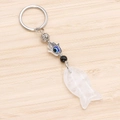 Hamsa Hand Evil Eye keychain with white crystal fish pendant on a rustic wood background - White Crystal