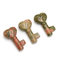 Three heart-shaped unakite natural stone key carvings with green and pink patterns - Unakite