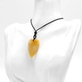 Polished yellow tiger eye heart stone pendant on a black adjustable cord necklace - Topaz