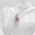 Lavender crescent moon face pendant necklace on a mannequin display for Halloween jewelry - Phosphosiderite