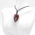 Polished red agate heart stone pendant on a minimalist black braided necklace cord - India Agate