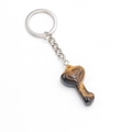 Tiger eye stone heart key-shaped keychain with decorative engraving on white background - Tiger's Eye
