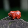 Miniature red jasper pig figurine hand-carved from natural gemstone with black marble texture - Red Jasper