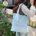 Detail of light blue nylon tote bag with pink San Francisco print and shoulder strap - Sky Blue