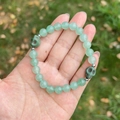 Green natural stone bead bracelet with skull charms and silver metal spacers - Green Aventurine