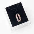 Pink natural rhodonite oval ring pendant necklace with black woven cord in a display box - With Rope / Rhodonite