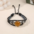 Multilayer leather bracelet featuring black braided rope with yellow crystal stone beads - Topaz