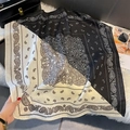 Macro detail of silk-feel paisley square scarf showing black and white diagonal patterns - FW-141-Black