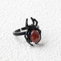 Adjustable black spider ring featuring a reddish-brown natural crystal teardrop gemstone - Red Jasper / Antique Silver