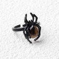 Adjustable black spider ring featuring a teardrop brown tiger eye crystal stone - Tiger's Eye / Antique Silver