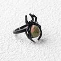 Black spider ring featuring a teardrop pink and green natural stone in an adjustable design - Unakite / Antique Silver