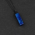Minimalist lapis lazuli rectangular pendant necklace with black cord on dark surface - Lapis Lazuli
