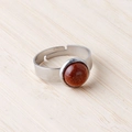 Silver stainless steel ring with 11mm round reddish brown goldstone on bamboo background - Gold Sand Stone (Synthetic)