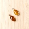 Tiger eye stone marquise pendant with gold plated copper edge and faceted finish - Tiger's Eye