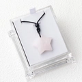 Pink star-shaped natural crystal pendant with black cord in a clear gift box - Rose Quartz