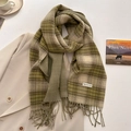 Detail of green and beige plaid scarf with soft fringe on a beige blazer background - 53*204cm / Green