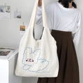 White sherpa tote bag with blue rabbit embroidery and 'Luck is for the lovely' text - Running Dog / Off White