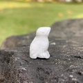 Miniature 1-inch bird carving in natural white agate stone on dark rock base - White Crazy Lace Agate