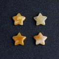 Set di quattro pietre d'agata in cristallo naturale a forma di stella giallo ambra - Topazio