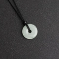 Natural light green donut crystal pendant with a sleek black adjustable braided necklace - Green Aventurine