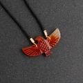 Eagle pendant carved from red agate with a black braided cord and golden clasp - Red Agate