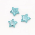 Three sky blue star-shaped synthetic turquoise beads with black spiderweb patterns - Turquoise (Synthetic)