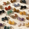 Detailed flat lay of various natural stone reindeer pendants with metal bails - Random 1pc