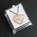 Handmade wire-wrapped heart necklace with white opal stone and a gold butterfly charm - Opal (Synthetic)